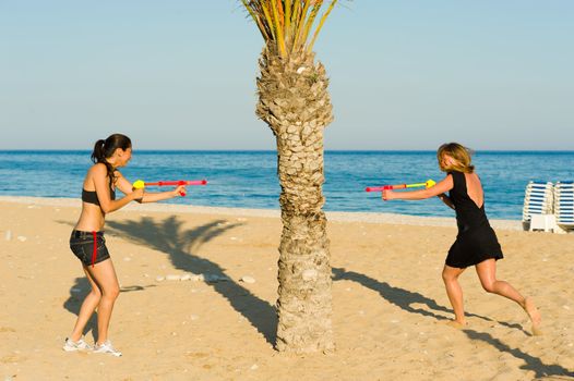 Girls in an intense water pistol fight