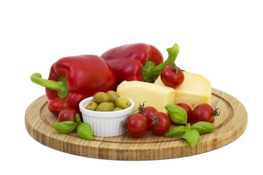 yellow cheese with fresh vegetables isolated on white background 