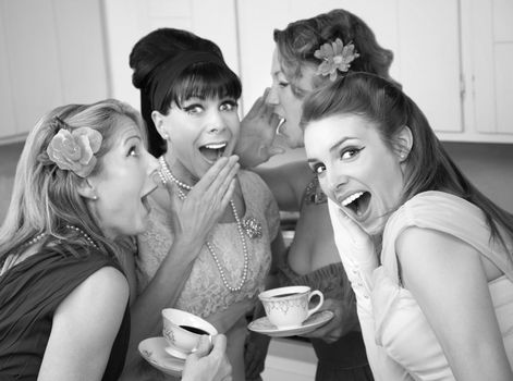 Group of four retro fashion housewives tell secrets in the kitchen