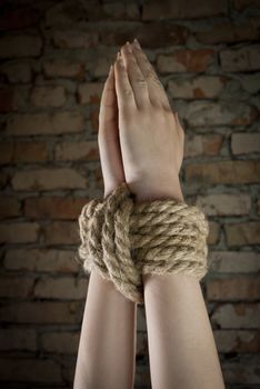 Hands tied up with rope