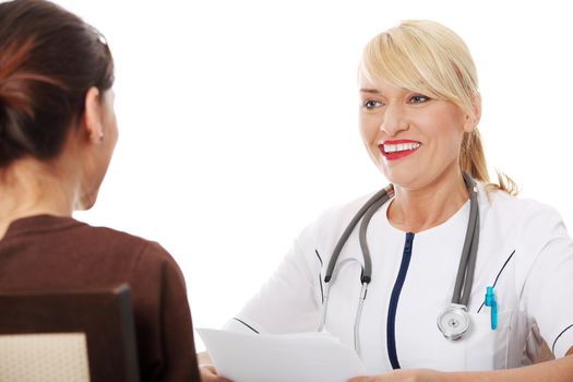 Mature female doctor talking with her patient.