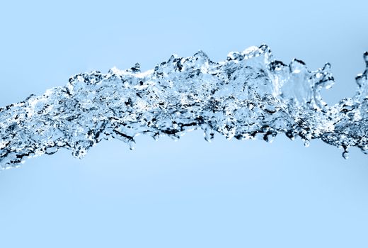 Water splash. Over blue background.