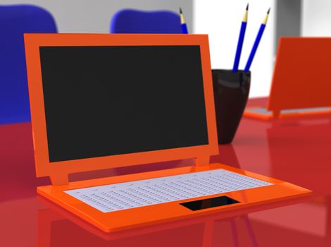 Orange laptop on red table with blue pencils