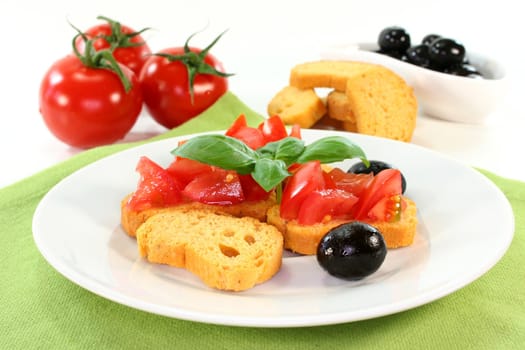 Bruschetta with tomatoes, olives and basil