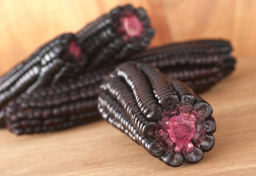 Peruvian purple corn, which is mainly used to prepare juice or a jelly-like dessert (Selective Focus, Focus on the front)