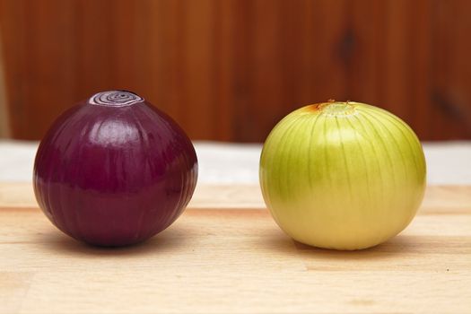Image of two different onions on a kitchen table.