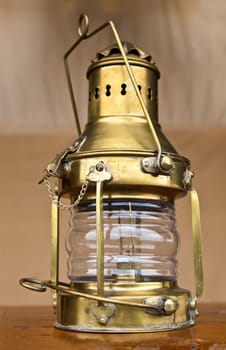 oil lamp on table in a canvas tent