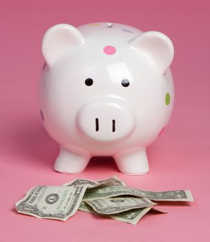 Piggy bank money pink background