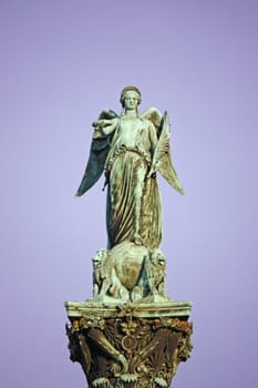 Statue on King Wilhelm jubilee column at Schlossplatz, Stuttgart, picture taken into the sunset