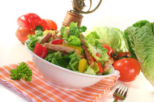 Mixed salad with turkey strips and fresh herbs