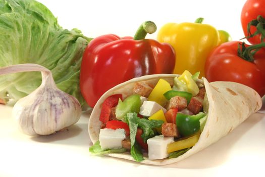 Wrap with mixed vegetables, cheese and turkey strips