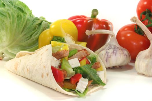 Wrap with mixed vegetables, cheese and turkey strips