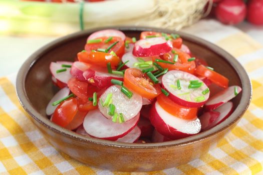 fresh radish and tomato salad with chives