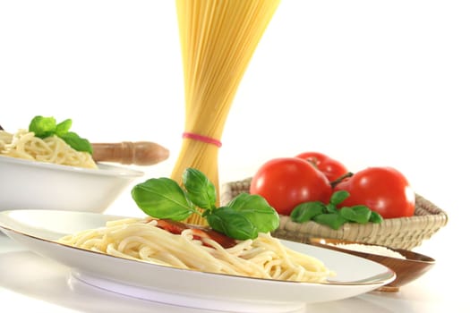 Spaghetti with tomato sauce and fresh basil