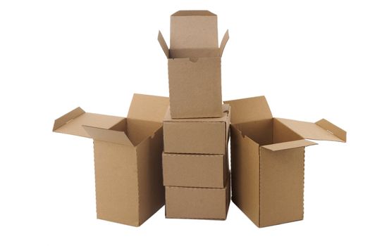 Brown cardboard boxes arranged in stack on white background