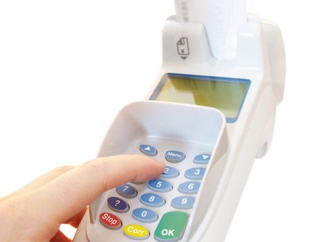 Person at a payment terminal, entering the PIN