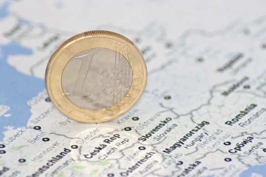 one euro coin on the map of Europe, close-up