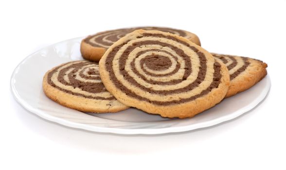 black and white cookies on the plate on white background