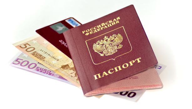 passport Euros and credit card on white background