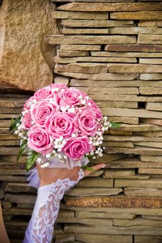 Bridal bouquet in the hand of bride