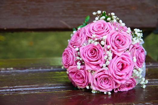 Bridal bouquet on the old bench