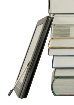 Stack of books and electronic book reader on the white background