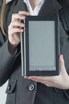 Girl holding a electronic book reader