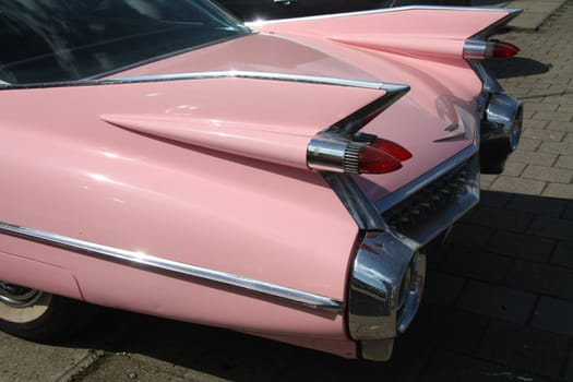 Detail of a pink vintage american car, 