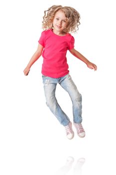 Cute happy smiling jumping of joy girl with heels together in pink shirt and jeans, isolated.