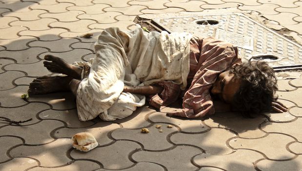 Man sleeping on the pavements of Bombay