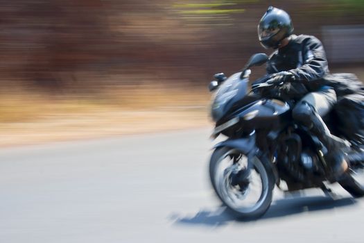 road burning motorcyclist, Goa to Mumbai, India