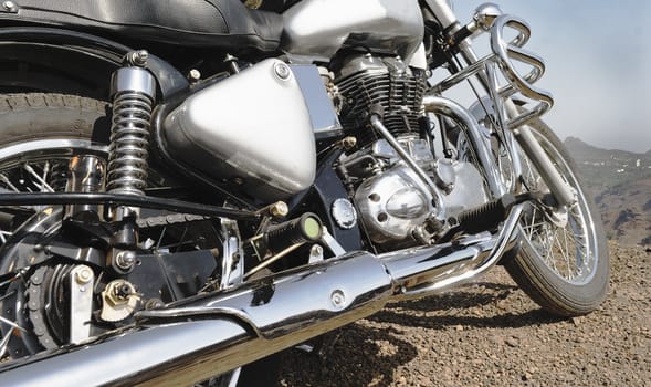 motorbike detailing, close up, parked edge of cliff, india, horizontal, copy space