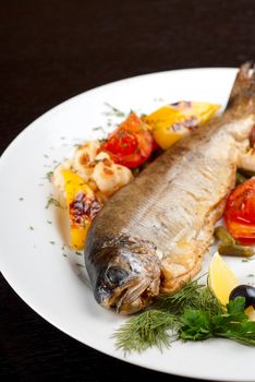 trout fish baked with pepper, string beans, tomato and cauliflower