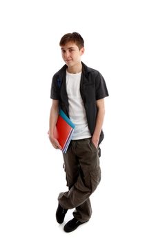A high school or college student stands in casual clothes and carrying some books under one arn.  White background.
