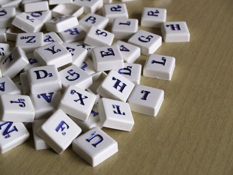 Scrabble pieces over wood background.