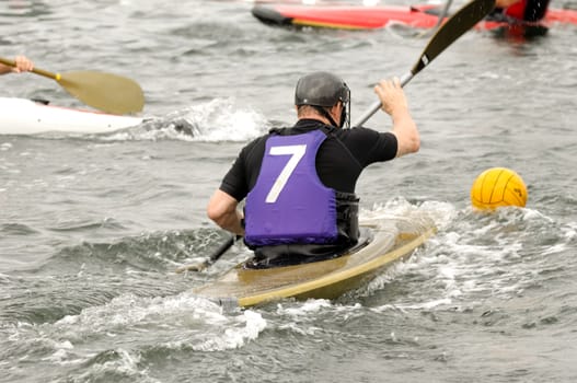 Man is palying kayak polo