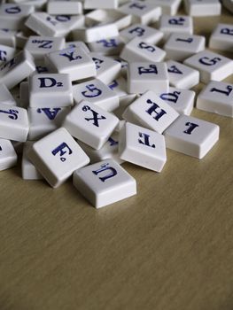 Scrabble pieces over wood background.
