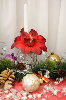 Christmas balls against the backdrop of tinsel with pine branches and cones