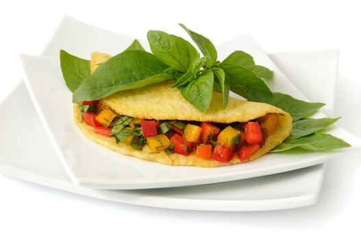 Omelette stuffed with vegetables with basil isolated