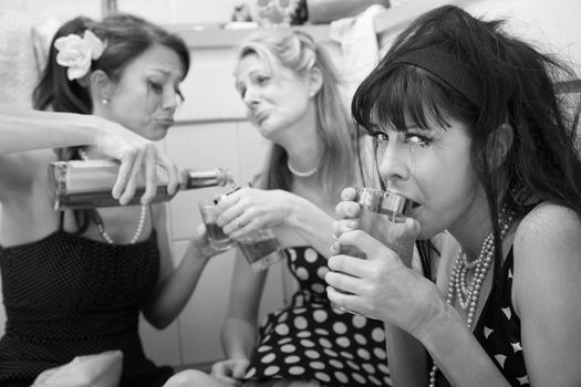 Mascara-smeared, drunk, sobbing women on kitchen floor