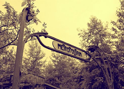 A metro entrance sign from Paris in vintage style