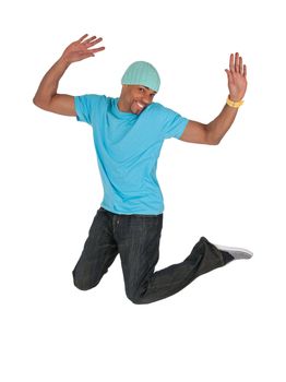 Smiling guy in a blue t-shirt jumping for joy, isolated on white background.