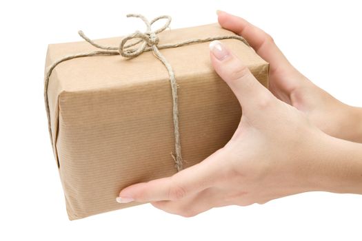 Female hands holding a brown parcel. Isolated on a white background.