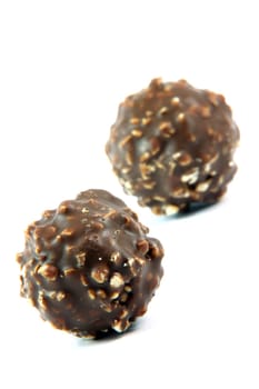 two ball chocolate cookies  focus on front blur back isolated food and sweets concepts