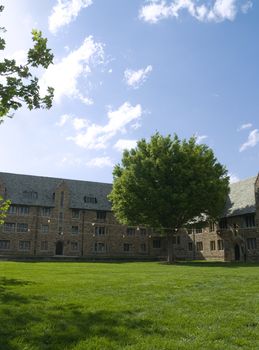 Grass field, with gothic style architecture on a spring afternoon.