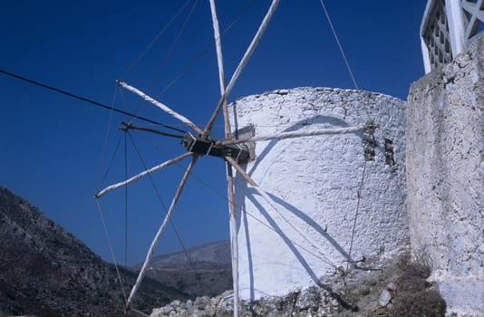 Taraditional stone built greek wind mill. Part of landscape in Olymbos and many other, lost villages.