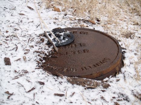 Water meter, frozen from the snow. It makes me thirsty looking at it.