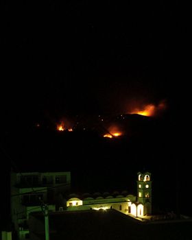 Fires are major problem in whole mediterranean. In Vilage Menets on Karpathos one could see in 08/2005 hills burning behind the old church.