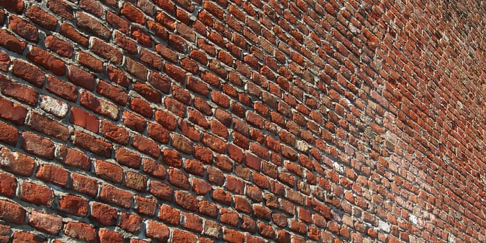 Red brick wall useful as a background - selective focus