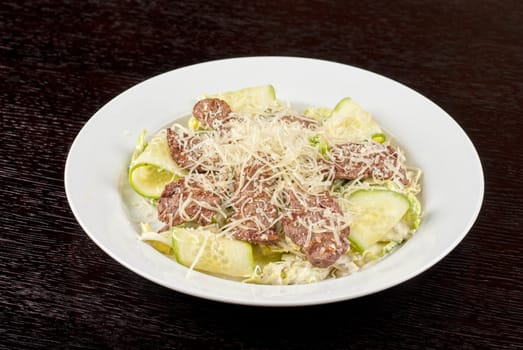 Salad with beef, lettuce, cucumber, string beans, Chinese cabbage and sauce